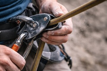 Secure Rock Climbing with Safety Gear: Close-up of Carabiner and Rope