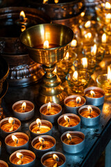 votive candles, main temple of the Sidrog Nuns, Gerima village, Tagong (Lhagang), Garzê Tibetan...