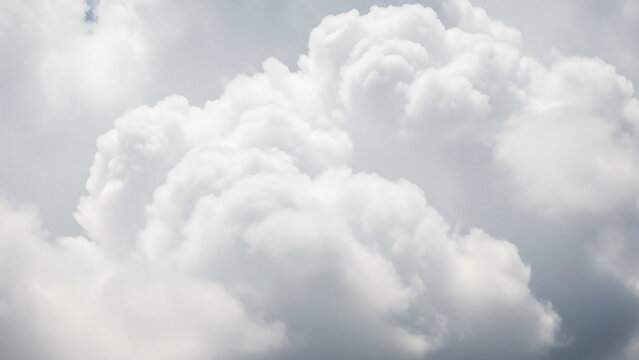 Close up of a large cloud in the sky. Natural cloudscape background in cloud dancer color. Weather concept. Cloud Dancer Color of the Year 2026