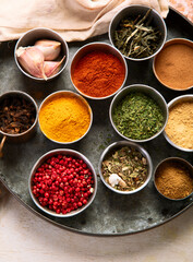 Different aromatic spices in bowls.