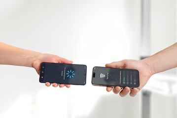 Contactless smartphone payment processing between mobile devices, displaying transaction workflow and digital payment status screen