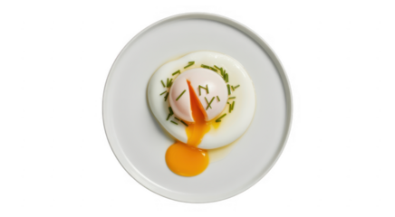 Poached egg on white plate with chives and yolk isolated on a transparent background