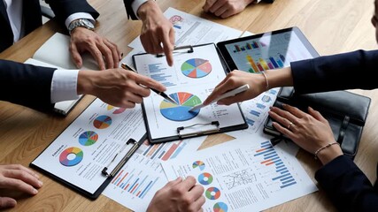 Business team discussing financial reports and data analysis in meeting 4k video - Powered by Adobe