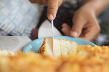 Close-Up of Knife Cutting Fluffy Cheese Bread