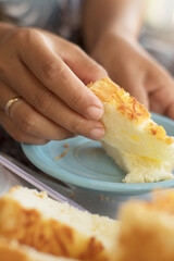 Golden-Topped Cake Served on Blue Plate