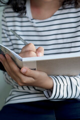 Personal Reflection in Cardboard-Backed Notebook