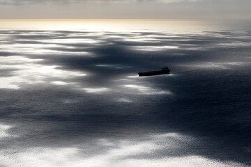big ship container aerial view from airplane window ad sunset