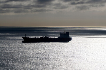 big ship container aerial view from airplane window ad sunset