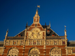 amsterdam central station at sunset