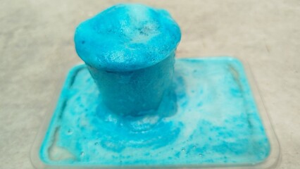 Blue bubble which formed as volcanic experimental result between food coloring, liquid soap, baking soda and acetic acid