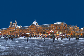 Tourists stroll through Red Square during New Year's celebrations late in the evening. Moscow, Russia.
