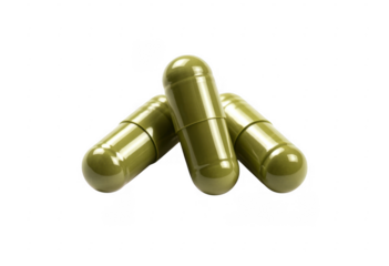 Three green capsules pills medicine isolated on a transparent background