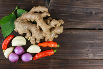 top view of various cooking spices such as chili, onion, garlic, pepper, ginger