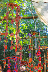 This is a Spider Web Tung, a traditional Lanna flag made of threads, used for religious ceremonies.