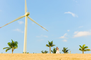 One Asian woman walking on beach along Hainan Coastal Scenic Highway in Dongfang city, Hainan, China