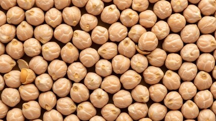 A dense, top-down view of numerous raw chickpeas filling the frame, offering a healthy and versatile ingredient for culinary use.