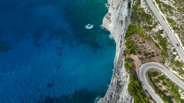 4K Cinematic Drone Footage of Cliffside Road in Zakynthos, Greece, Curving Above Turquoise Ionian Sea and Limestone Coastline