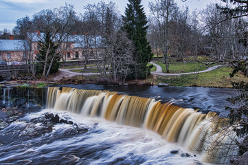 Scenic View of Keila Waterfall and Historic Manor Park in Estonia