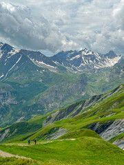 Fototapeta premium Couple Hiking down the Tour du Mont Blanc near the Col du Bonhomme in Summer