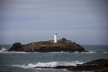 Godrevy Lighthouse at Godrevy Beach in Cornwall, UK.