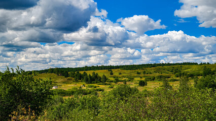 Hills with meadows and forests.