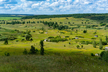 Hills with meadows and forests.