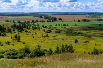 Hills with meadows and forests.
