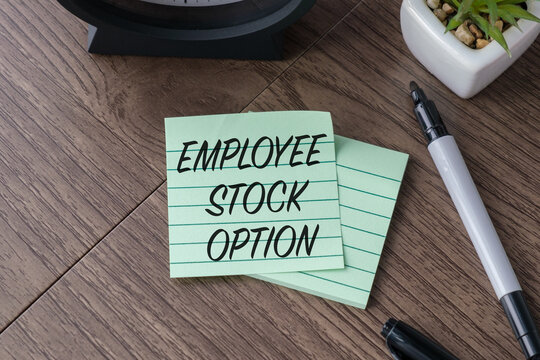 Concept of ESO Employee Stock Option write on page on Wooden Table. Business Concept