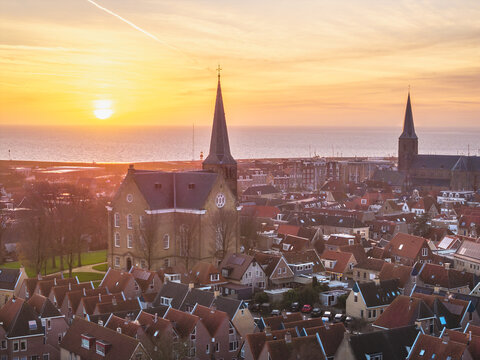 Aerial drone view of Harlingen old town and harbour at sunset
