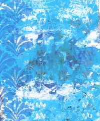 Peeling and deteriorating wallpaper and painted wall