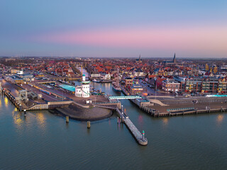 Fototapeta premium Aerial drone view of Harlingen ferry terminal at dusk