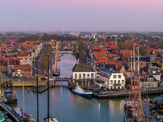 Fototapeta premium Aerial drone view of Harlingen harbour at sunset