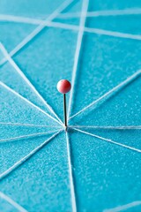 Pin connected by threads with a blue background