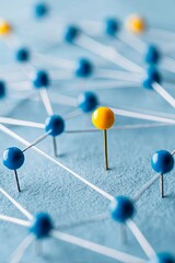 Pushpins connected by threads with a blue background