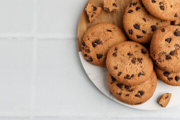 Delicious chocolate chip cookies on light table, top view. Space for text