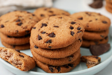 Delicious chocolate chip cookies on table, closeup