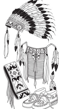 Traditional Native American regalia including feathered headdress dreamcatcher and decorative footwear and textiles.
