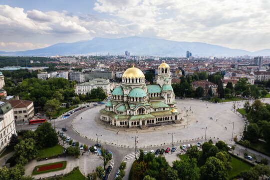 Aerial view of the magnificent Patriarchal Cathedral St. Alexander Nevsky, with its golden domes and intricate architecture standing out against the city skyline, Sofia, Sofia, Bulgaria.