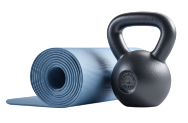 Rolled blue yoga mat and black kettlebell for home fitness and gym workout concepts.

