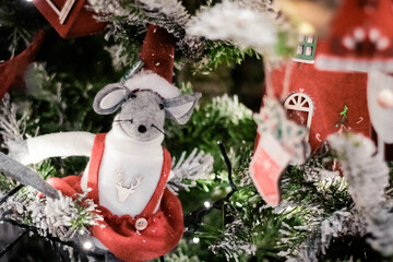 Christmas decorations on the branches of an artificial Christmas tree