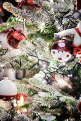 New Year's background with a Christmas tree decorated with toys and lights