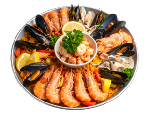 A beautifully arranged seafood platter featuring shrimp, mussels, and lemon wedges on a decorative plate