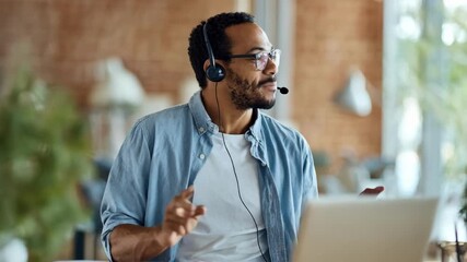 Medium shot of a businessperson engaged in a video call discussing financing approvals with remote colleagues - Powered by Adobe