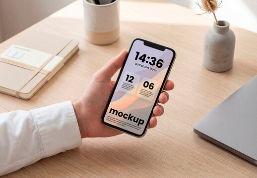 Phone screen mockup on work desk
