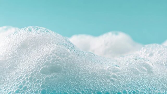 Beauty Product Foam Soap. Abstract background white soapy foam flowing texture. Shampoo foam with bubbles. Bubble surface isolated on pastel blue coral rose color. Suds. Facial cleanser. Froth Pattern
