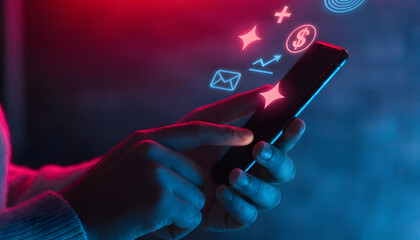 Hand holding phone with neon icons, digital payment and social media symbols, vibrant lighting