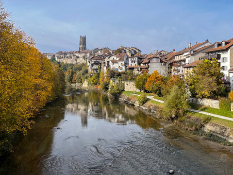 View of old swiss city Fribourg on river saane os sarine at autumn