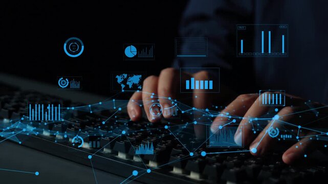 Close-up of hands typing on a keyboard while virtual graphs and charts are displayed in a dark office. This image captures data analysis and modern technology in action. Xenic