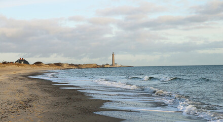 Naklejka premium Morris Island Lighthouse from the shoreline of Folly Beach near Charleston, South Carolina.