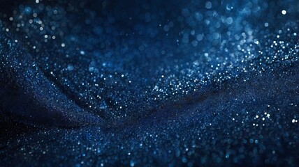 An abstract dark blue background with glowing particles and a soft bokeh effect creating a wavy pattern. A backdrop concept for banners, presentations, or luxury branding concepts.
